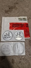 JE Design Center Cap Badges