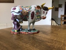 A Dutch Polychrome Delft  18th Century Cow and Milking Group.