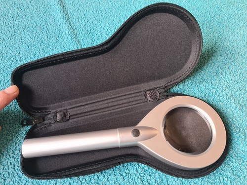 Magnifying glass with - glass, by