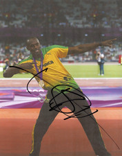 ATHLETICS: USAIN BOLT SIGNED 10x8 LONDON 2012 CELEBRATION PHOTO+COA **JAMAICA**