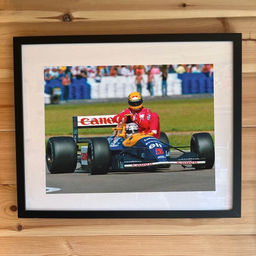 Nigel mansell gives ayrton - mansell,