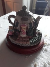 TEAPOT WITH LITTLE CHARACTERS