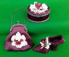 MINIATURE BURGUNDY SATIN SHOE, EVENING BAG & TRINKET BOX TRIO.