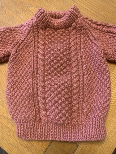 Hand knitted childs aran