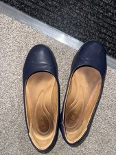 Very worn old black cabin crew