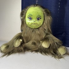 Baby Grinch Doll Sitting