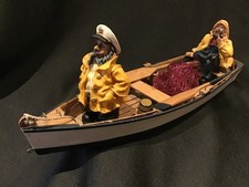 Handmade Wooden Rowing Boat with Sailor Figures.