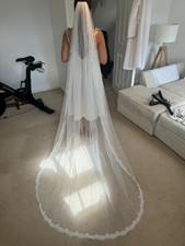 Chapel length 90” ivory veil, lace trim , brand new never worn, clip included