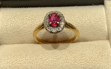 18 carat yellow gold oval ruby ring 10 cluster set diamonds in eight cut style