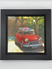 Framed painting of a red Mini car with Union Jack roof