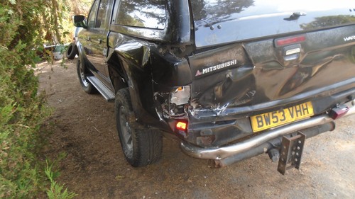 Mitsubishi 200 rear - l, damage