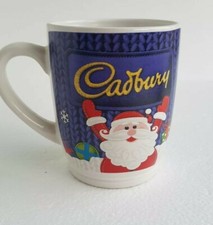 Cadburys Purple Christmas  Santa Snowflakes Coffee Mug holding up Cadbury sign