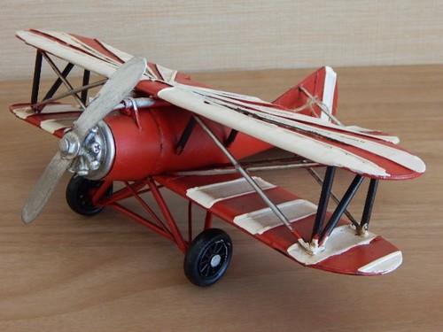 Vintage red metal biplane - vintage,