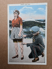 OLD POSTCARD WOMAN BATHING LEGS POLICEMAN UNIFORM LAW HUMOUR BEACH PS 233