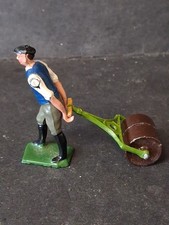 Man Pulling Garden Roller By