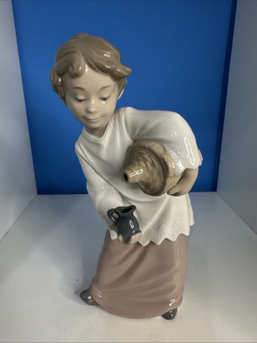 Nao lladro boy - by, with