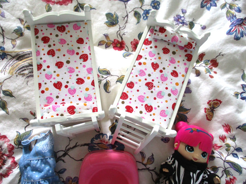 Small doll with - small, dress