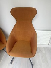 A pair Allermuir Famiglia High Back Burnt Orange Chairs