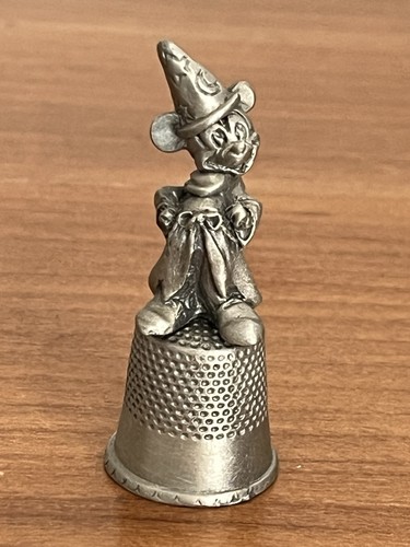 Pewter thimble featuring