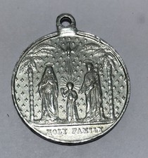 Large Holy Family medal, religious item depicting Jesus, Mary, and Joseph 