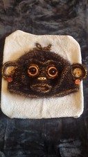 Monkey hat. Handmade, Quirky and bespoke headwear. Black and Gold. 