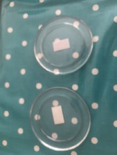 A pair of Clear glass candle