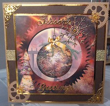 handmade men's steampunk christmas card with a brass golden bauble & cogs design
