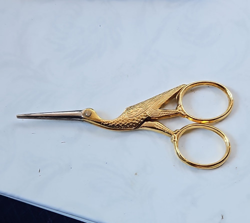 Gold tone metal stork - gold,