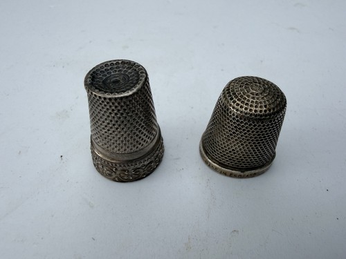 Two silver thimbles - two, no
