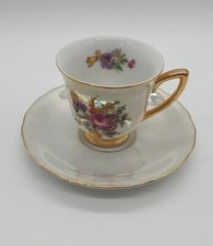 Vintage RGK pearlescent teacup and saucer edged with gold gilt