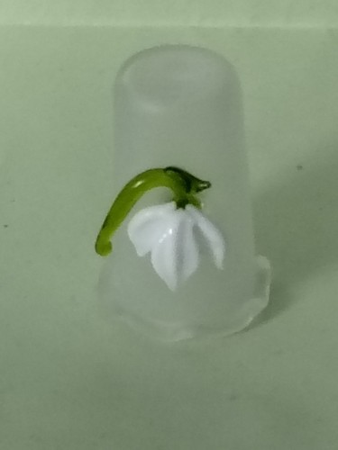 Glass thimble with embossed - with,