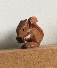 tiny hand carved wooden red squirrel