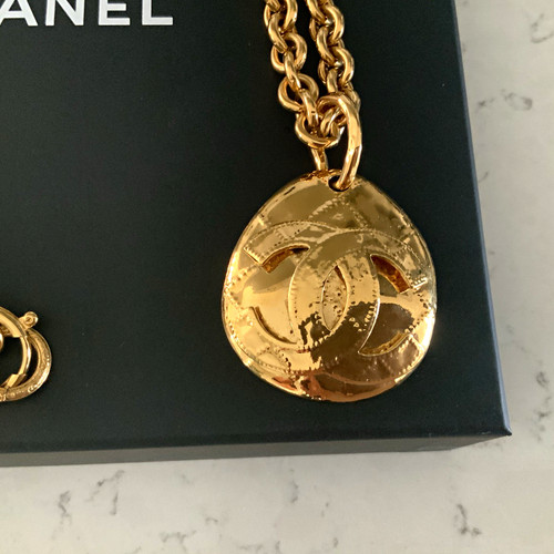 Chanel gold tone metal round - chanel,