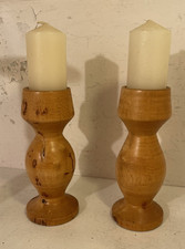 A pair of vintage wooden candle holders