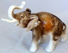 ELEPHANT WITH RAISED TRUNK -