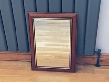 WALL MIRROR WITH WOODEN SURROUND & GOLD TRIM.