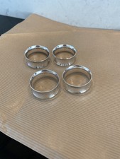 Four silver plate napkin rings