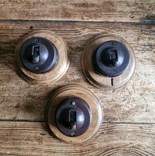 Crabtree Bakelite and China Dolly Switches on Beech Pattress. 2 Way. 1 Left