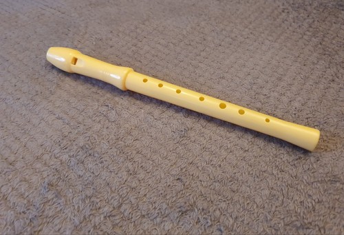Cream yellow plastic flute