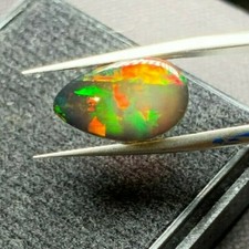 3.55 CTS NATURAL ETHIOPIAN MULTI-COLORED BLACK OPAL, PEAR CAB 14.90 X 8.85 MM