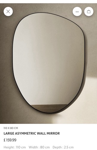Large irregular shaped mirror