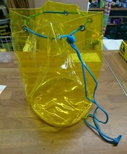 Pvc transparent childs yellow bag with pull cord 28cm tall