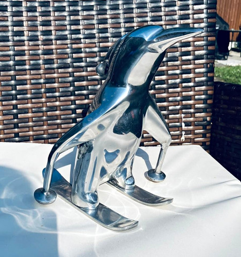 Penguin skiing polished metal - penguin,