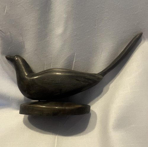 Black stone carved bird - stone,