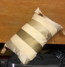 Dunelm cream gold stripe bolster style cushion inc insert tassel