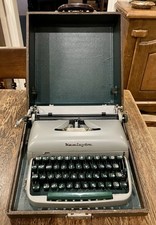 Remington Travel Riter Typewriter with Case and Two Ribbon Rolls