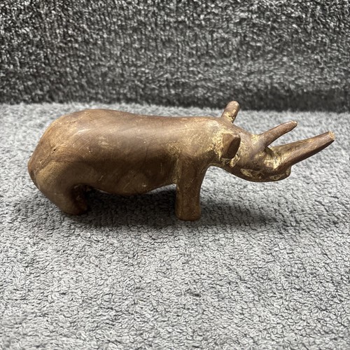Hand crafted wooden rhino - hand,