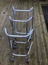 Lightweight zimmer frame with wheels.