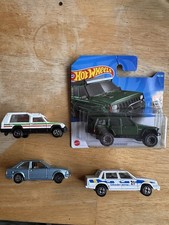 3 Original Corgi Cars And One Unopened Hot Wheels Jeep.