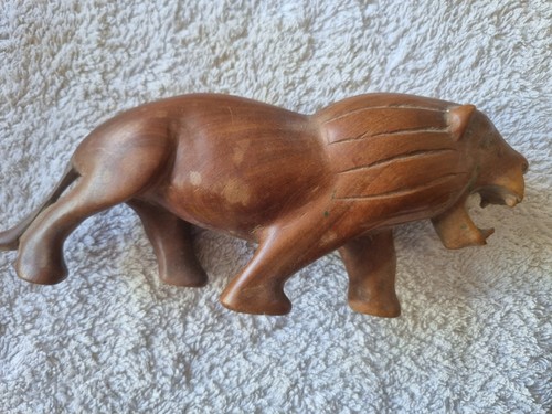 Carved wooden lion figurine - carved,